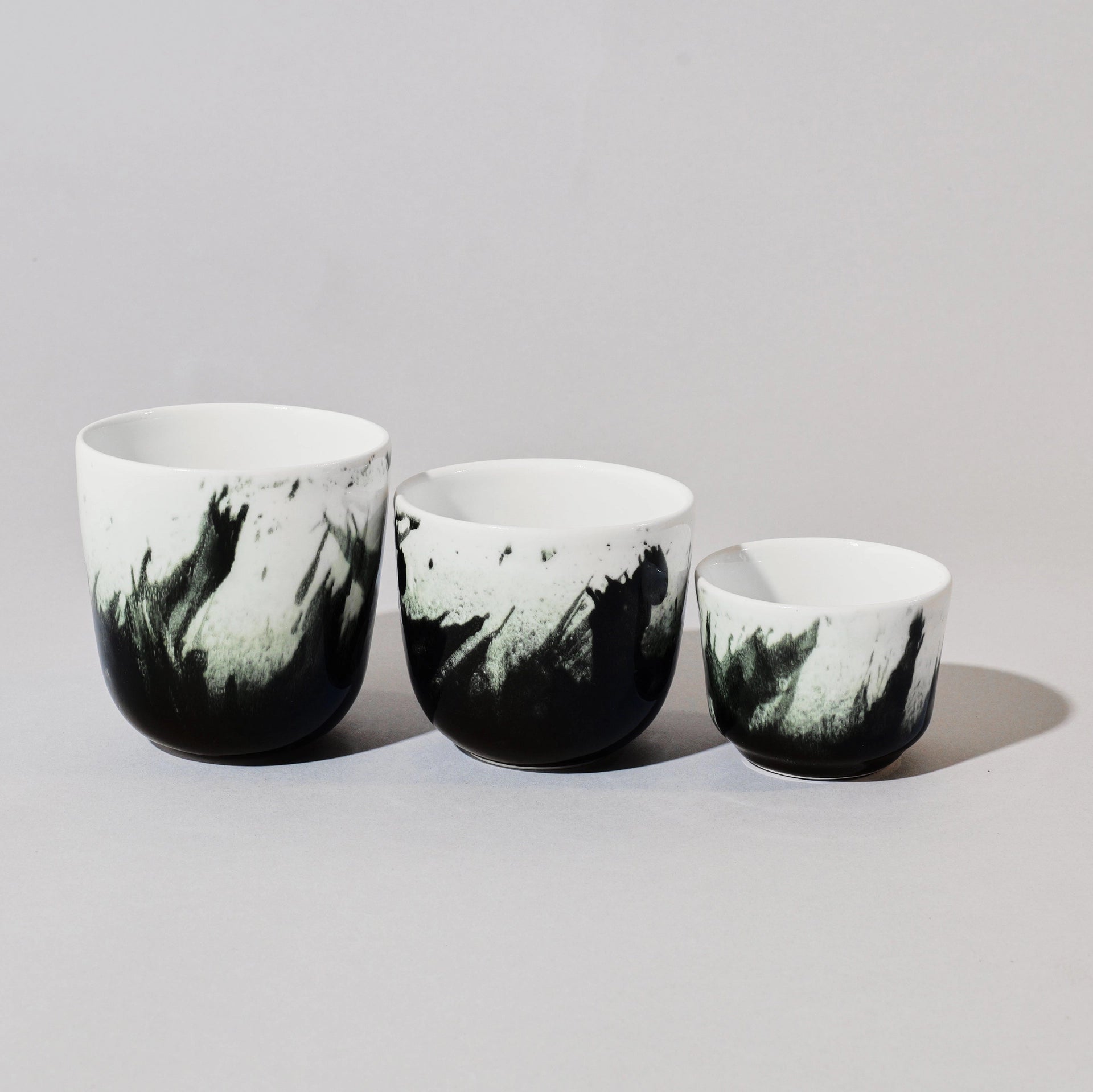 Hand crafted ceramic coffee cup with black and white brushstroke finish, FLTR Coffee